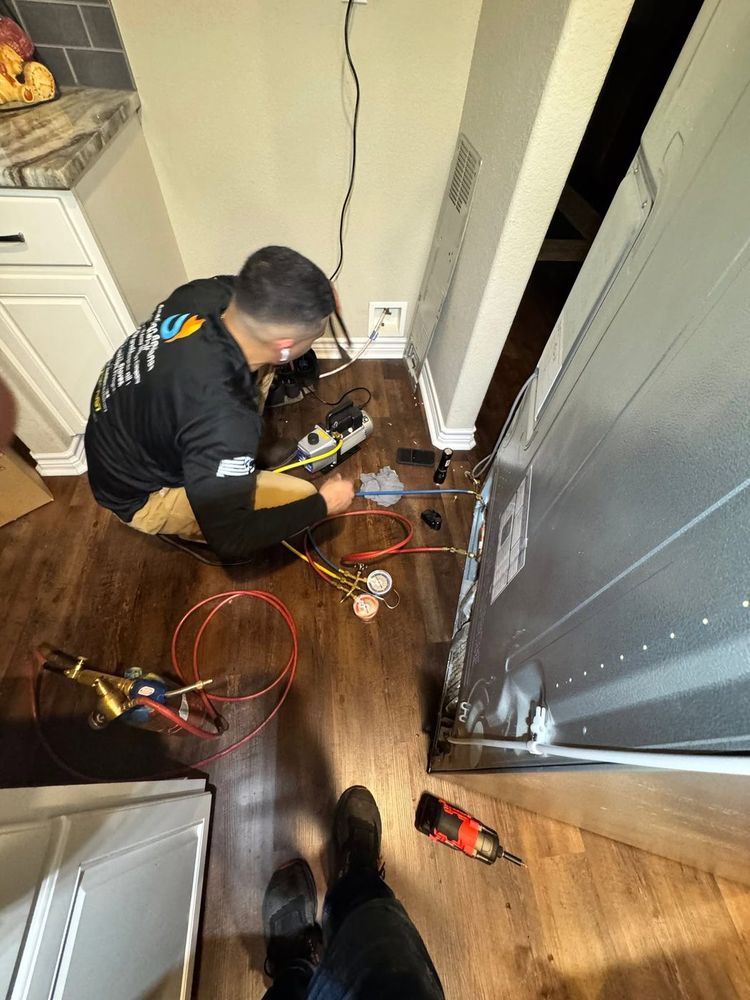 Pulled out and opened up — the real work usually happens behind the appliance, not in front of it.