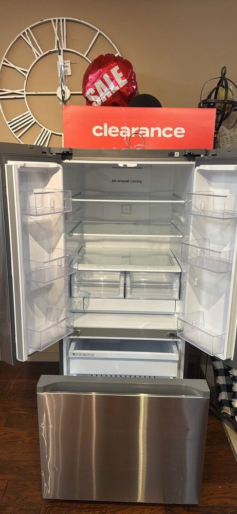 A clearance-tagged refrigerator — full function, better price. Scratch-&-dent is the smartest money in appliances.
