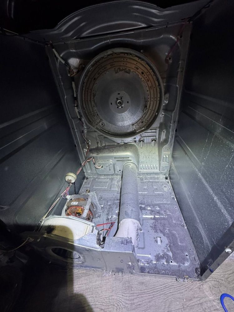 Inside a dishwasher: pumps, seals and spray arms serviced so dishes come out clean again.