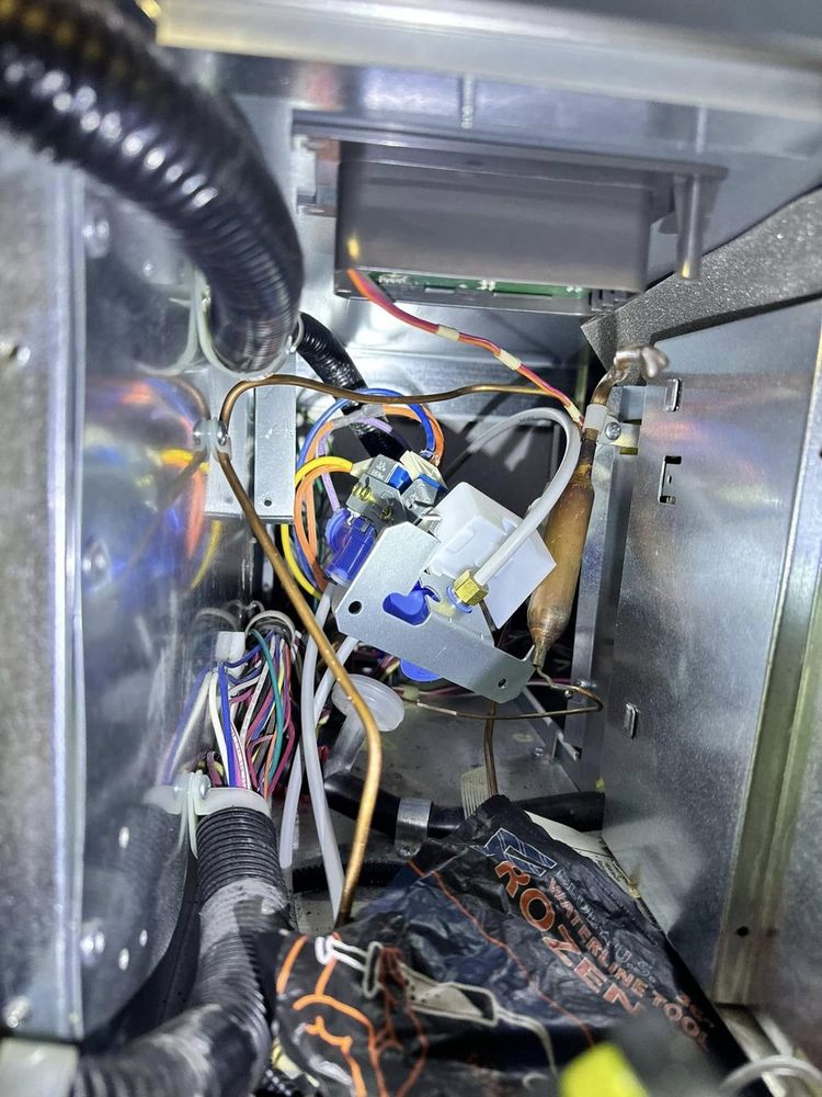 Behind the panel: wiring, valves and controls checked as part of a full diagnosis.
