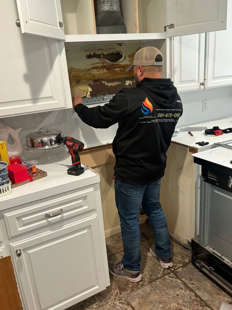 On-site in a Corpus Christi kitchen — appliance and vent work done clean, with the workspace protected.