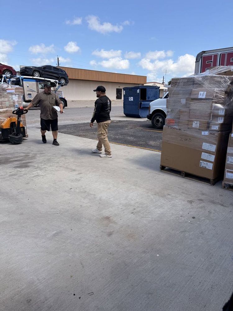 Delivery day — pallets of appliance parts arriving at the shop, headed straight for the shelves.