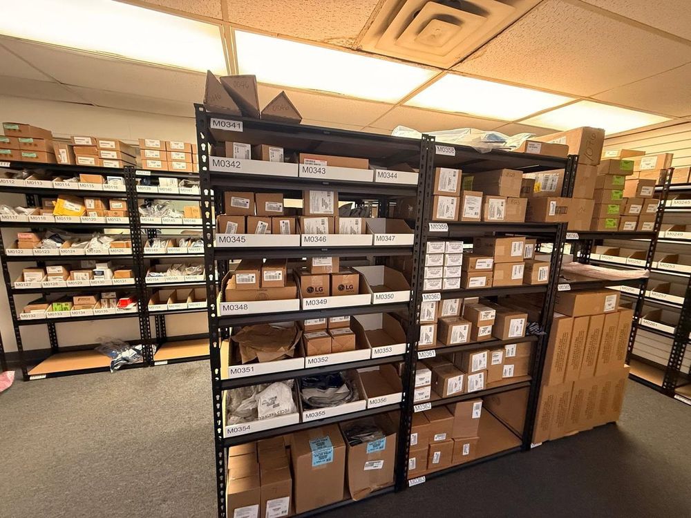 Shelf after shelf of boxed parts — the inventory behind our one-visit repairs.