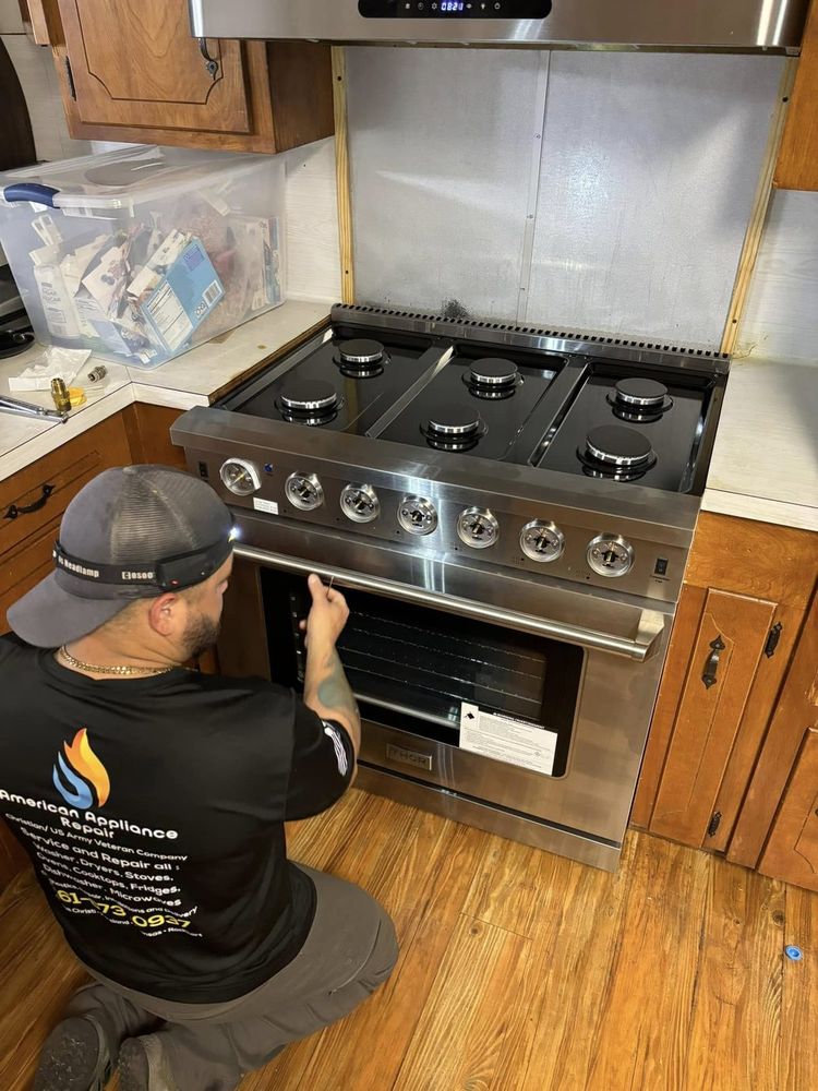 Servicing a gas range on site — burners, igniters and controls checked before we call the job done.