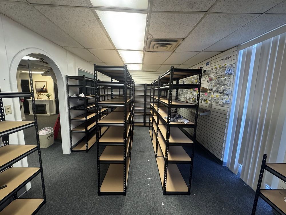 Fresh racking installed and waiting to be filled. The parts department keeps expanding.